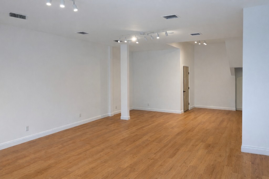 The Grand Bedford interior with track lighting and hardwood floors