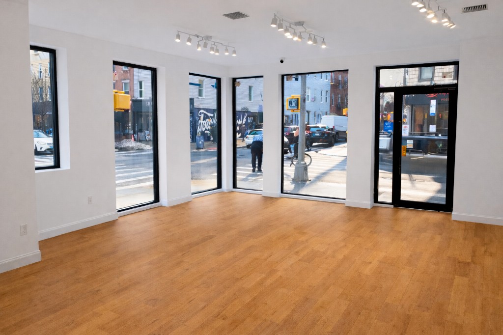 The Grand Bedford interior with large windows overlooking Williamsburg street